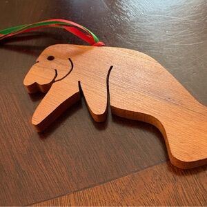 Hand crafted Wooden Walrus Ornament with Red and Green Ribbon